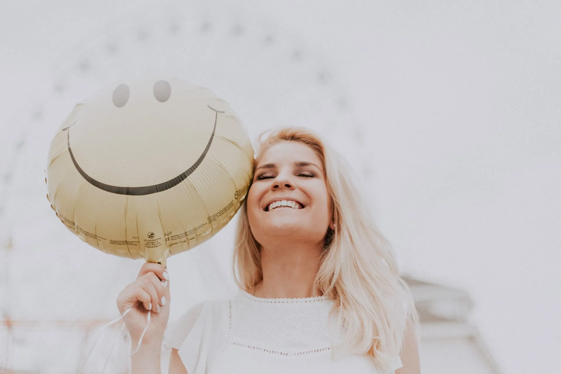 Woman smiling with her eyes closed that seems to be at peace